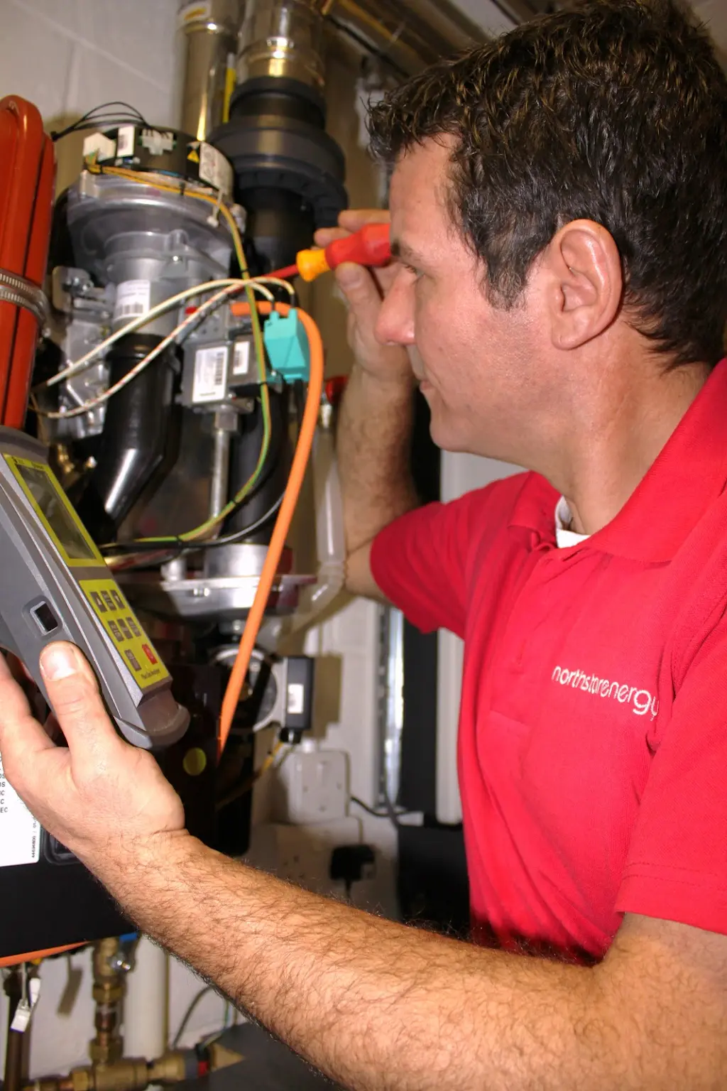 Our engineer testing a gas boiler with a flue gas analyser